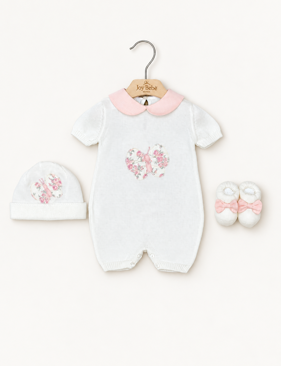 Coordinato Baby Lord su sfondo bianco caldo naturale