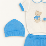 Coordinato Baby Lord su sfondo bianco caldo naturale